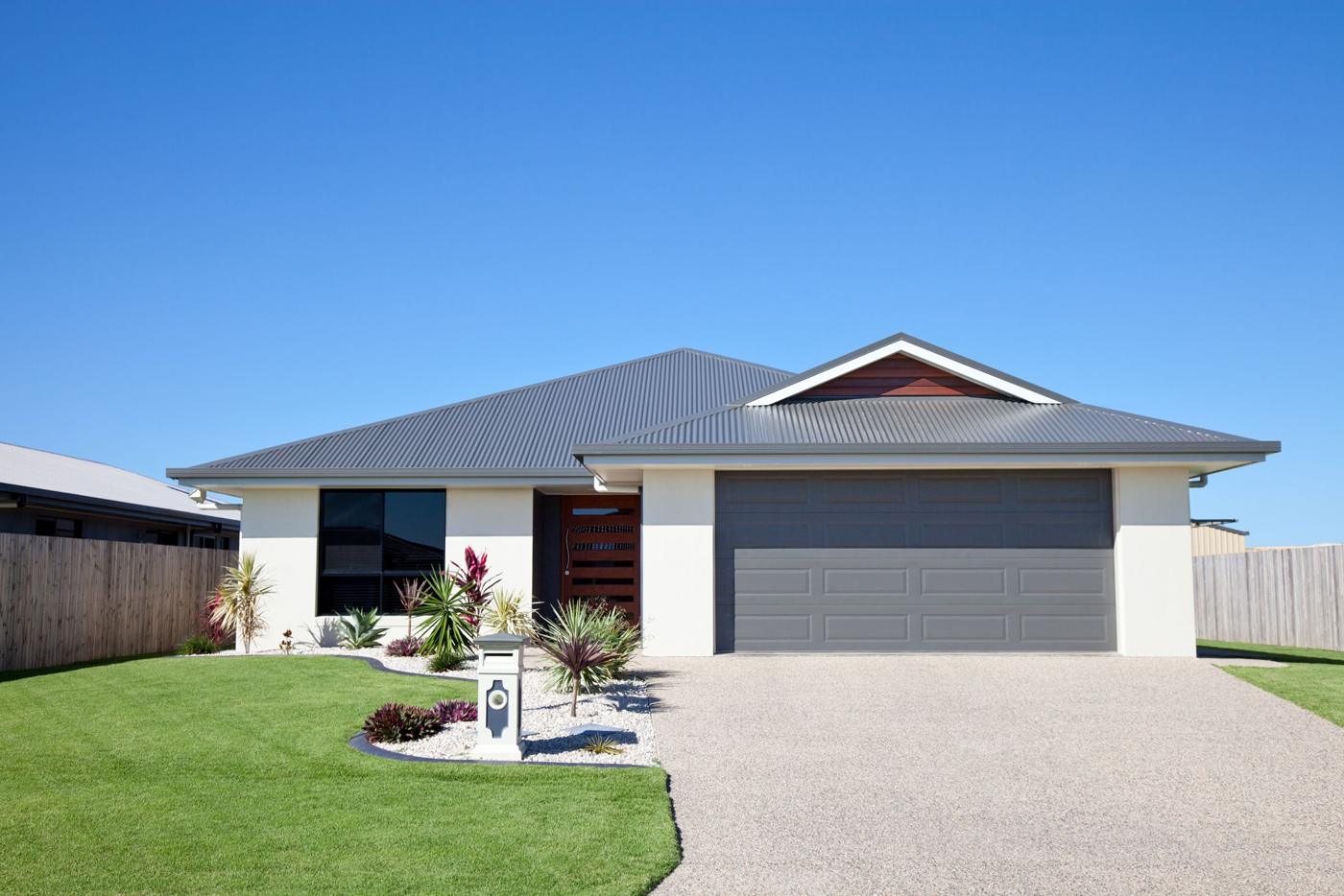 A single story home with a two car garage